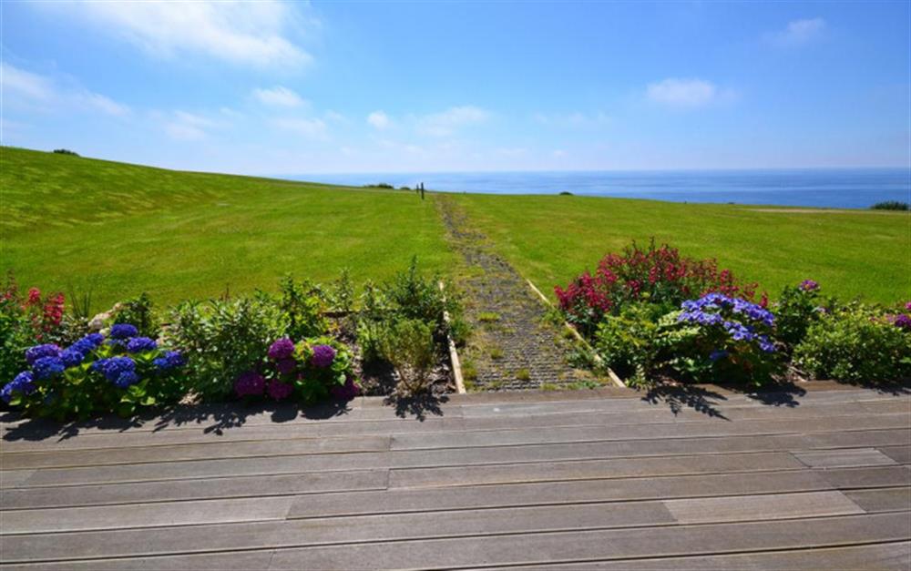 The extensive decking area looking out to sea at 40 Talland in Talland Bay