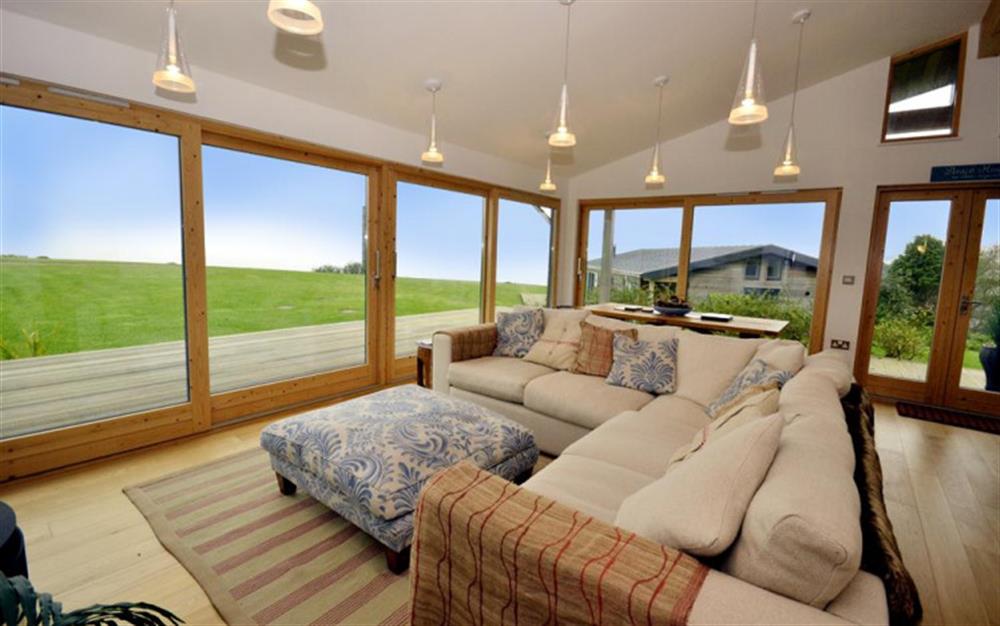 The living area with panoramic views at 40 Talland in Talland Bay