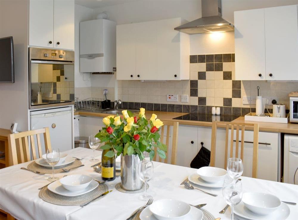 Well equipped kitchen/ dining area at 42 Gurnard Pines in Gurnard, near Cowes, Isle of Wight
