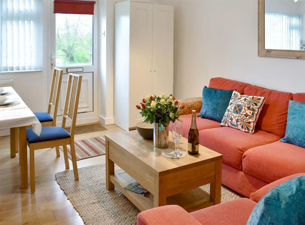 Well presented living/ dining area at 42 Gurnard Pines in Gurnard, near Cowes, Isle of Wight