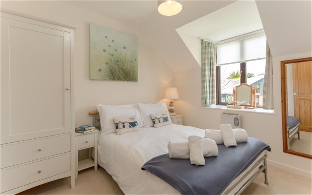 Splashes of gentle colour make the second bedroom a relaxing place to sleep. at 44 Upper Stables in Maenporth