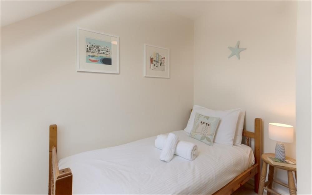 The pictures on the wall give the white walls a lift.  at 44 Upper Stables in Maenporth