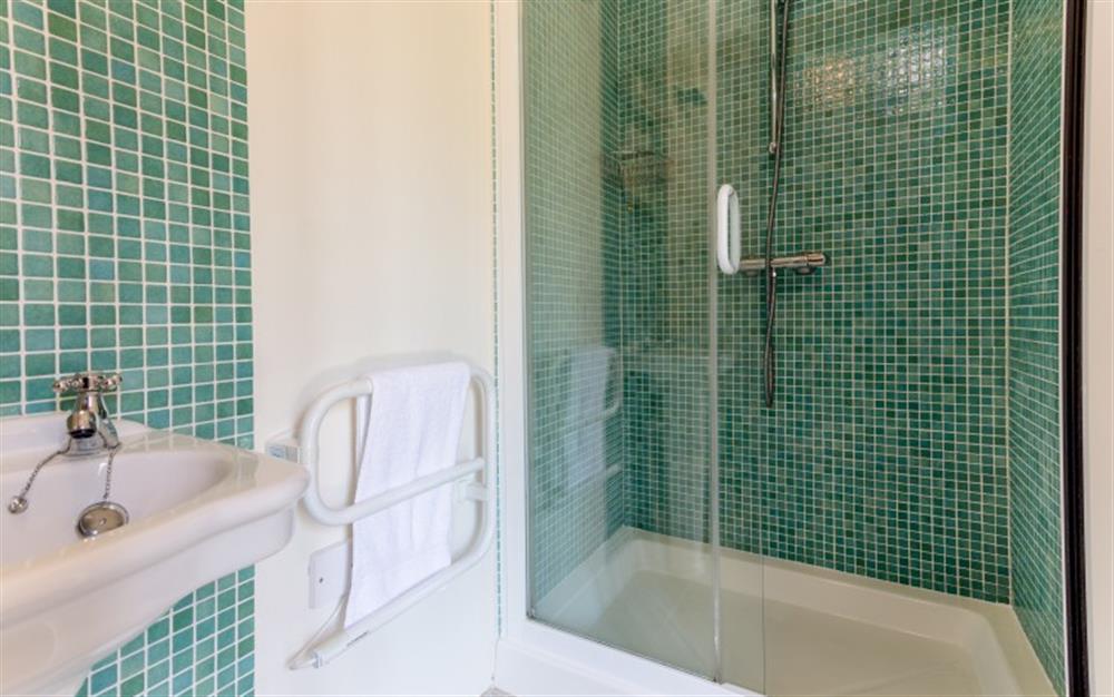 The spacious shower cubicle has matching tiles in the downstairs bathroom. at 44 Upper Stables in Maenporth