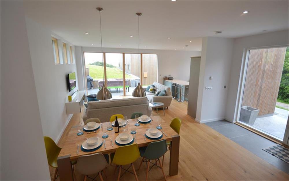 The dining room with living and kitchen to the rear. at 45 Talland in Talland Bay