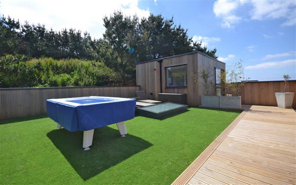 One half of the exciting roof terrace with pool table and sun loungers at 47 Talland in Looe