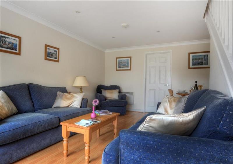 Relax in the living area at 48 Fernhill Heights, Charmouth