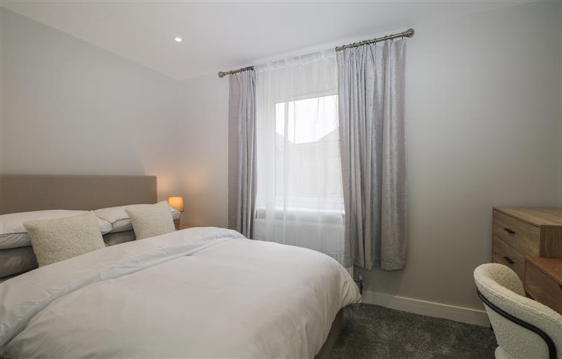 This is a bedroom at 4A One Bed Apartment with patio and private entrance, Seaford