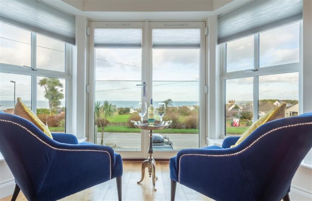 Take in the sea view through the huge bay window