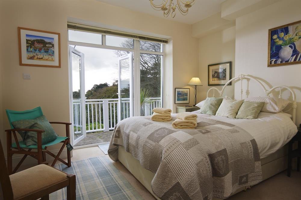 Master bedroom with en suite and french doors leading to the balcony at 5 Grafton Towers in North Sands, Salcombe