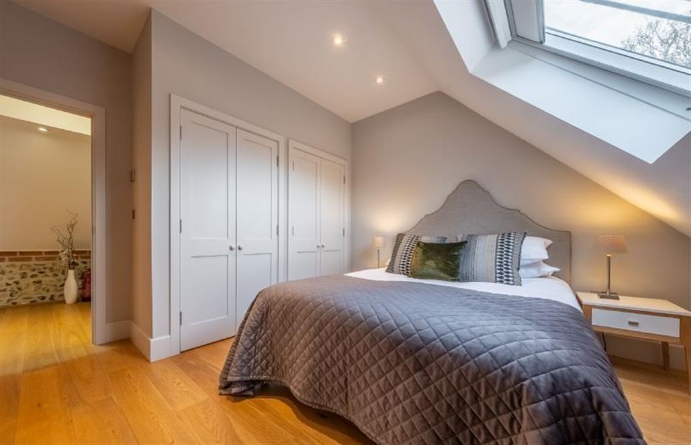 Bedroom one is serviced by the family bathroom  at 5 Manor Farm Barns, Brancaster