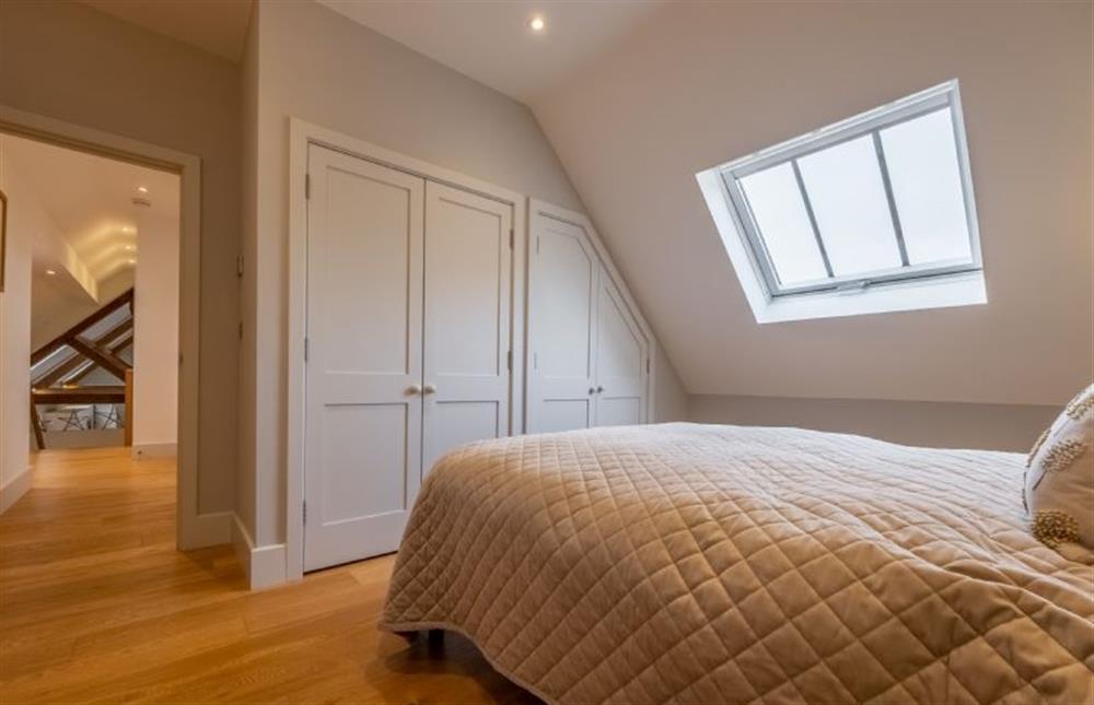 Bedroom two is serviced by the family bathroom  at 5 Manor Farm Barns, Brancaster