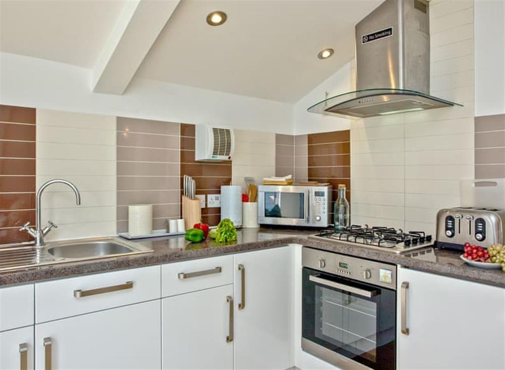 Well equipped kitchen area at 5 Park Mews in Weymouth, Dorset