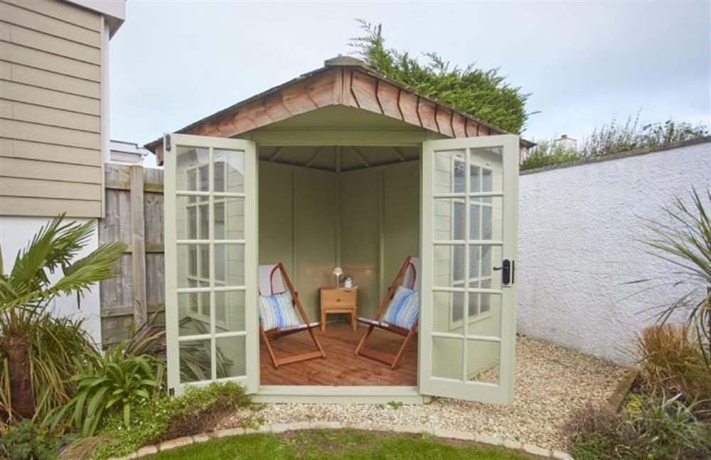 A charming summerhouse in the enclosed garden  at 5 The Sands, Polzeath
