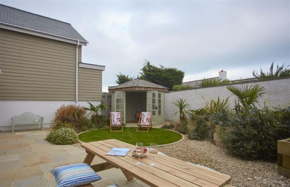 Enjoy the garden on the wooden picnic table at 5 The Sands, Polzeath