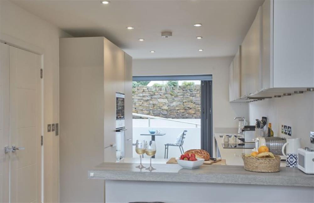 The  kitchen opening up to the front of the property at 5 The Sands, Polzeath