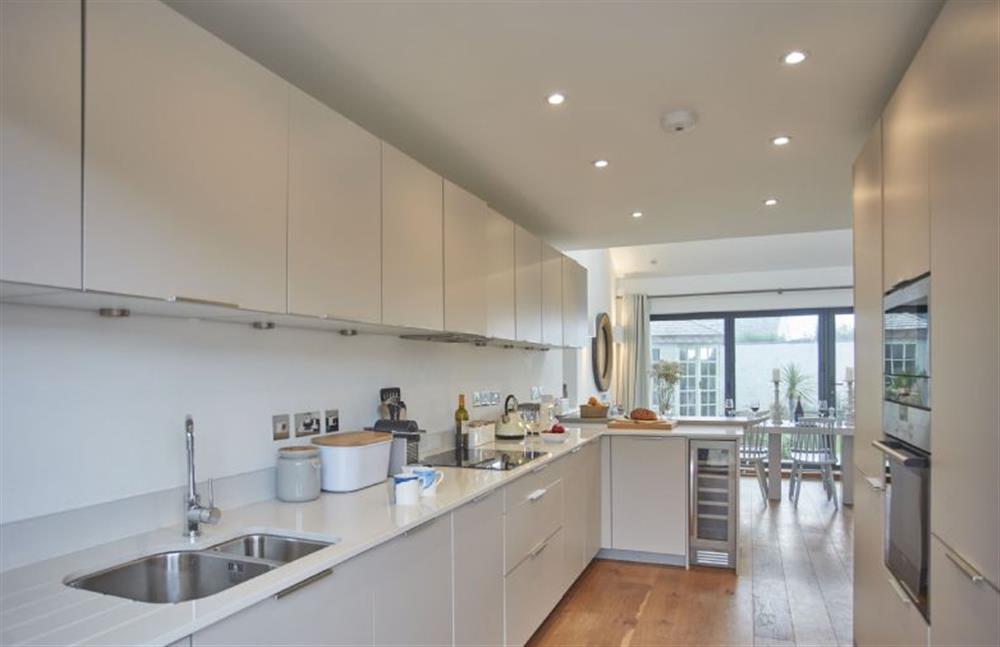 The modern, well-equipped kitchen leads into the garden at 5 The Sands, Polzeath