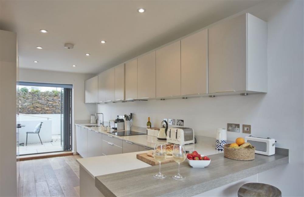 The modern, well-equipped kitchen with breakfast bar at 5 The Sands, Polzeath