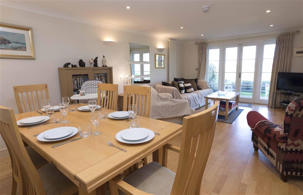 Lounge area with dining table at 5 Thurlestone Beach Apartments in Thurlestone, Nr Kingsbridge