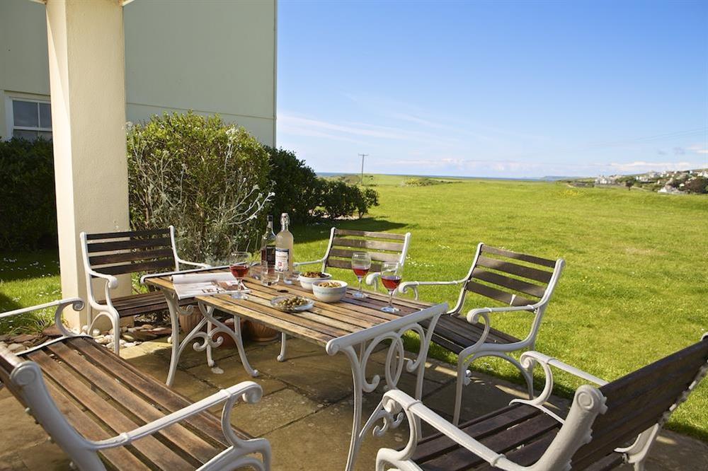 Take in the views across the gardens towards the coastline from the patio at 5 Thurlestone Beach Apartments in Thurlestone, Nr Kingsbridge
