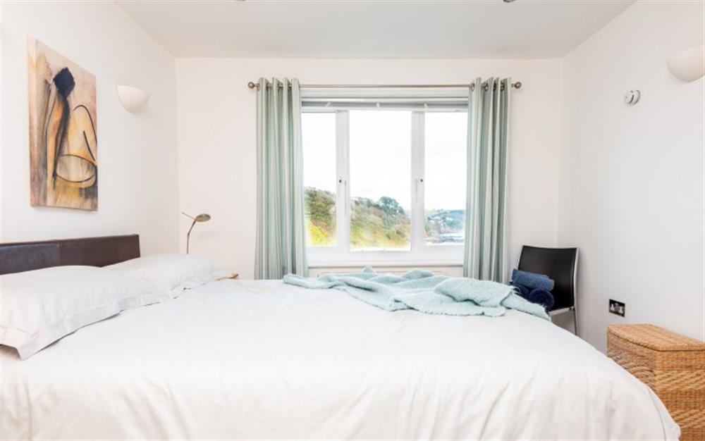 The master bedroom with superb views  at 5 Westcliff Apartment in Looe