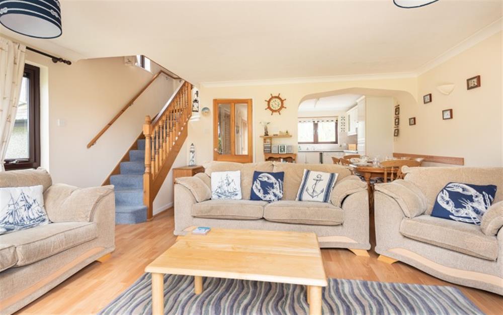 Stairs from the lounge lead up to the 3 bedrooms and family bathroom at 55 Upper Maen Cottage in Maenporth