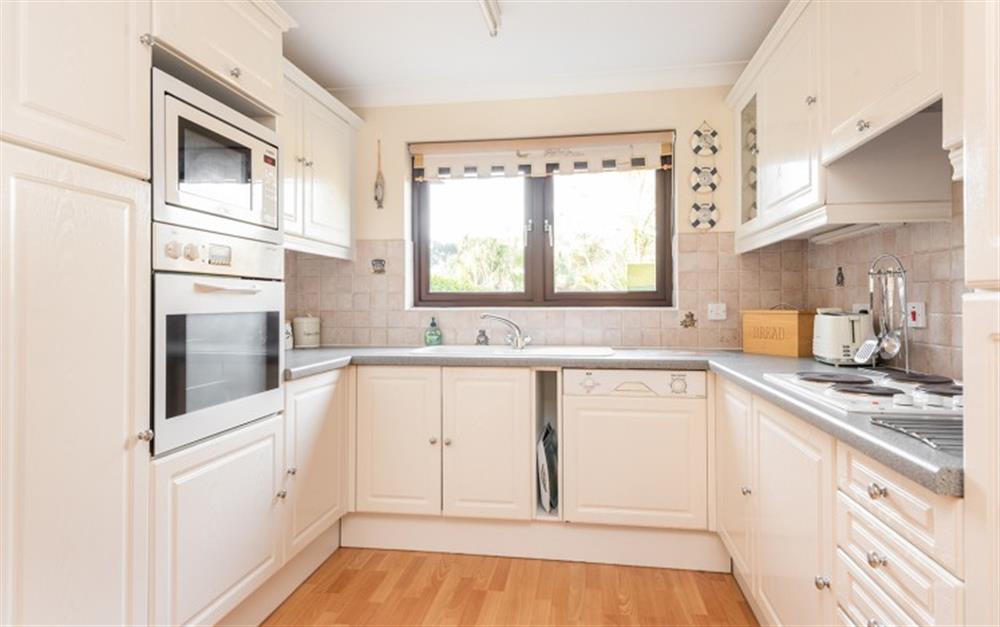 The appliances in the kitchen are full size and integrated at 55 Upper Maen Cottage in Maenporth