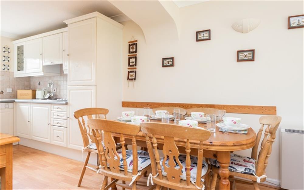 The dining table comfortably seats six at 55 Upper Maen Cottage in Maenporth