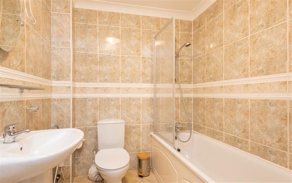 The family bathroom benefits from an additional shower, over the bath at 55 Upper Maen Cottage in Maenporth