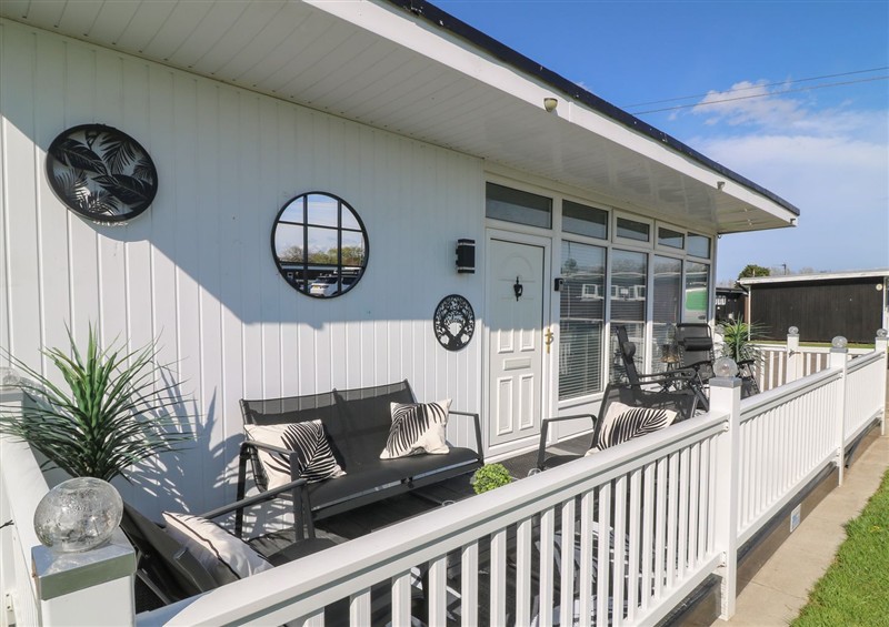 Enjoy a cup of tea on the patio at 56 Cherry Park Chalet, Chapel St Leonards