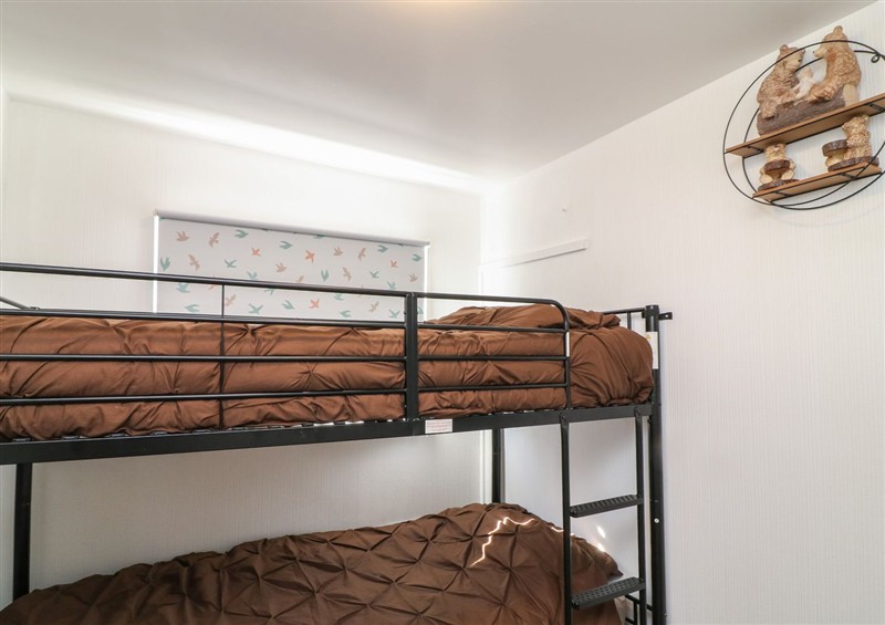 One of the bedrooms at 56 Cherry Park Chalet, Chapel St Leonards