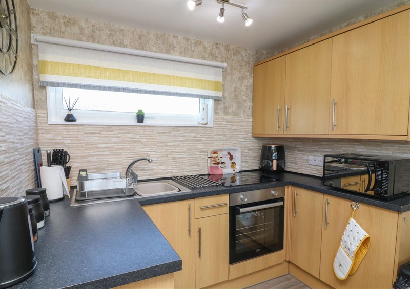 The kitchen at 56 Cherry Park Chalet, Chapel St Leonards
