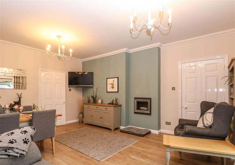 Relax in the living area at 57 The Street, Brundall