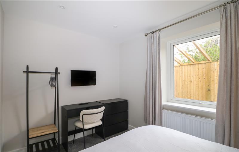 This is a bedroom at 5A One Bed Apartment with patio and  private entrance, Seaford