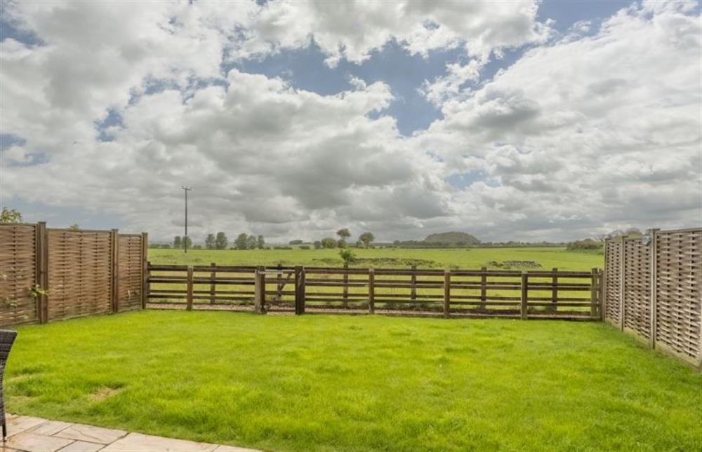 Enclosed garden with views over the neighbouring fields (photo 3) at 6 Courtyard Barn, Docking