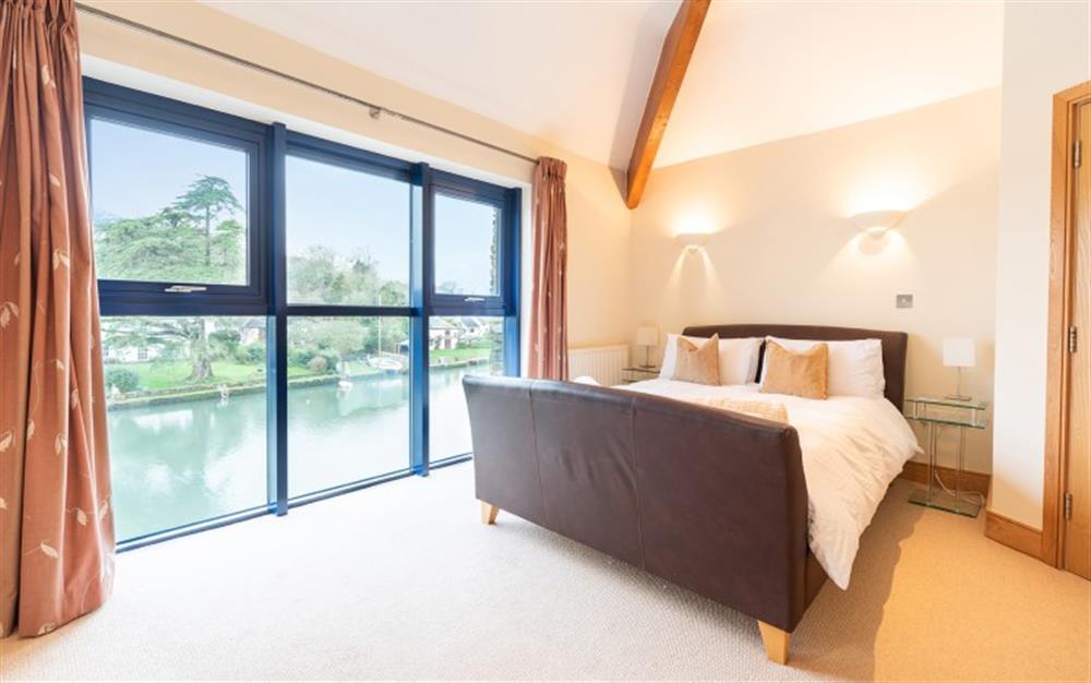 The master bedroom enjoys stunning views of the water - what a lovely view to wake up to! at 6 Crabshell Quay in Kingsbridge