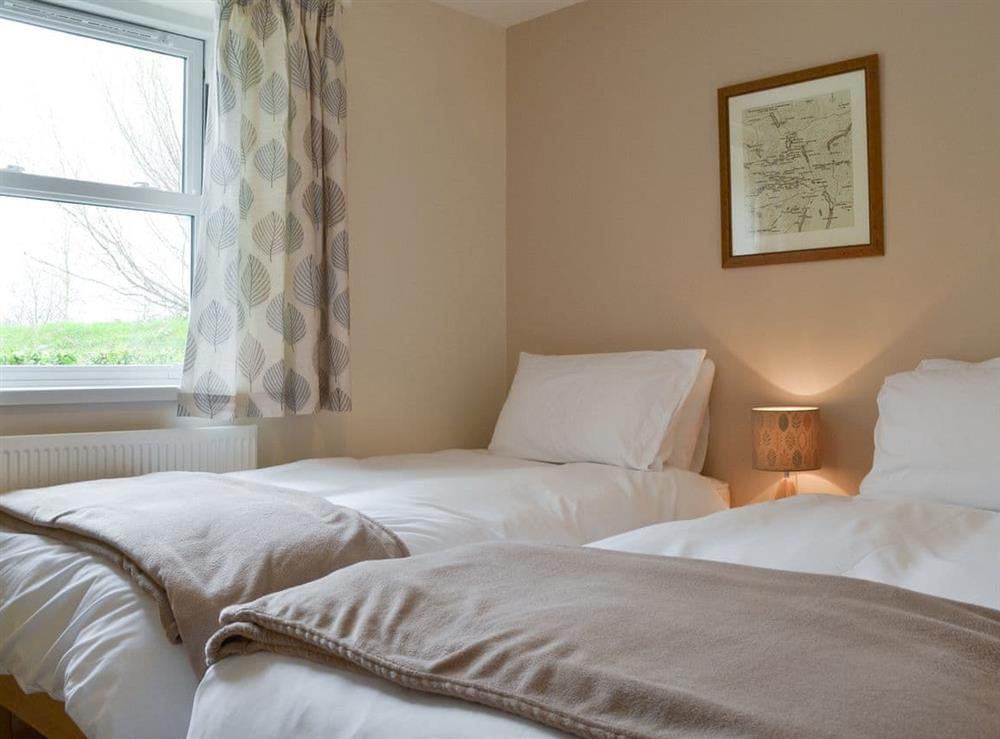 Comfortable twin bedroom at 6 Elm Court in Keswick, Cumbria