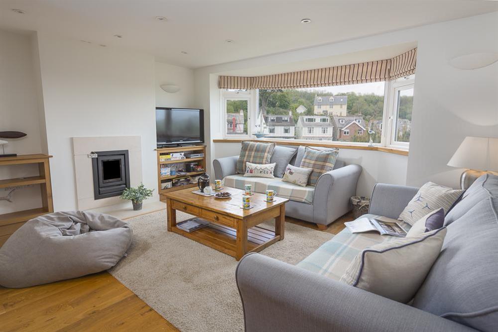Delightful open plan sitting room with two comfortable sofas at 6 Knowle Court in , Salcombe