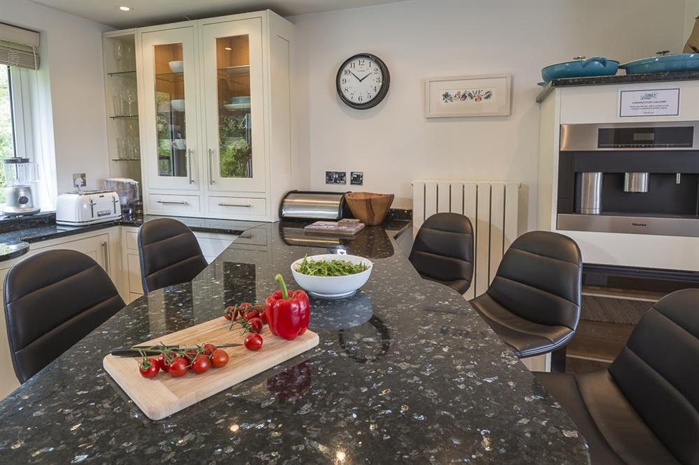 Modern kitchen with breakfast dining bar and stools (photo 3) at 6 Knowle Court in , Salcombe