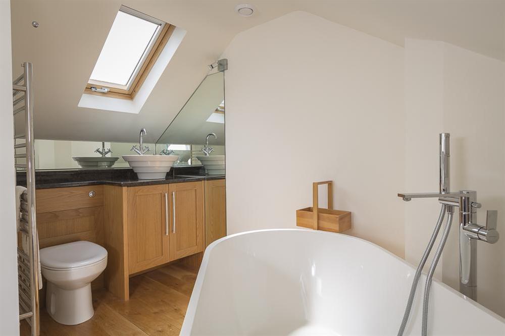 The open en suite has a lovely freestanding bath (photo 2) at 6 Knowle Court in , Salcombe