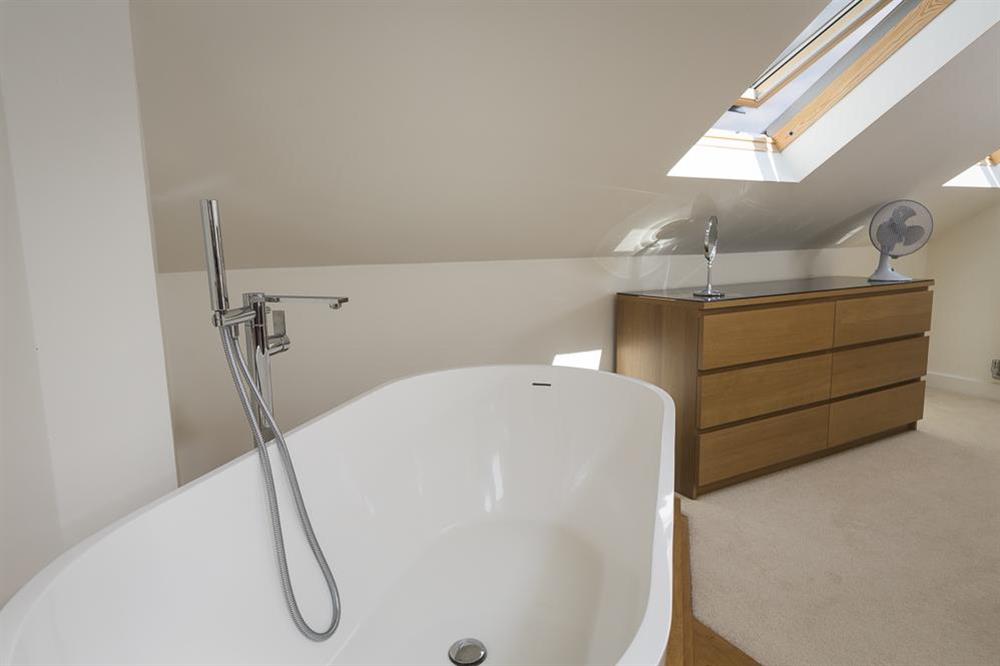 The open en suite has a lovely freestanding bath at 6 Knowle Court in , Salcombe