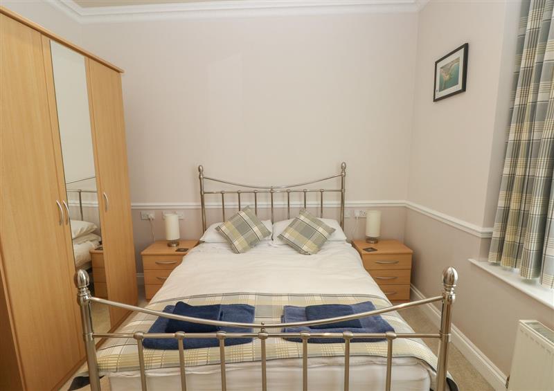 This is a bedroom at 6 South Beach Court, Tenby