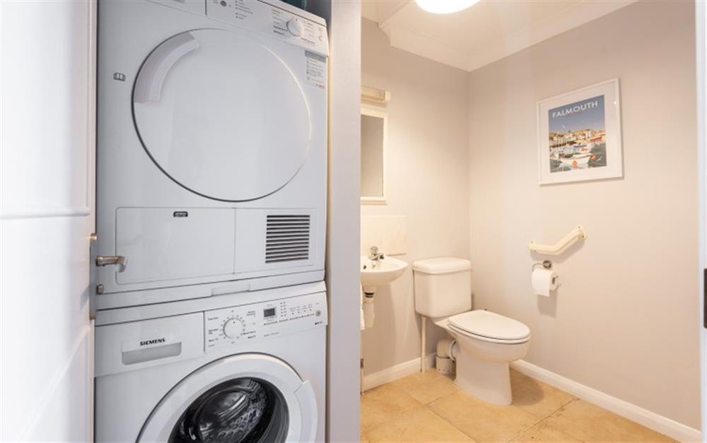Washing machine and tumble drier in the downstairs cloakroom at 62 Lower Maen Cottage in Maenporth