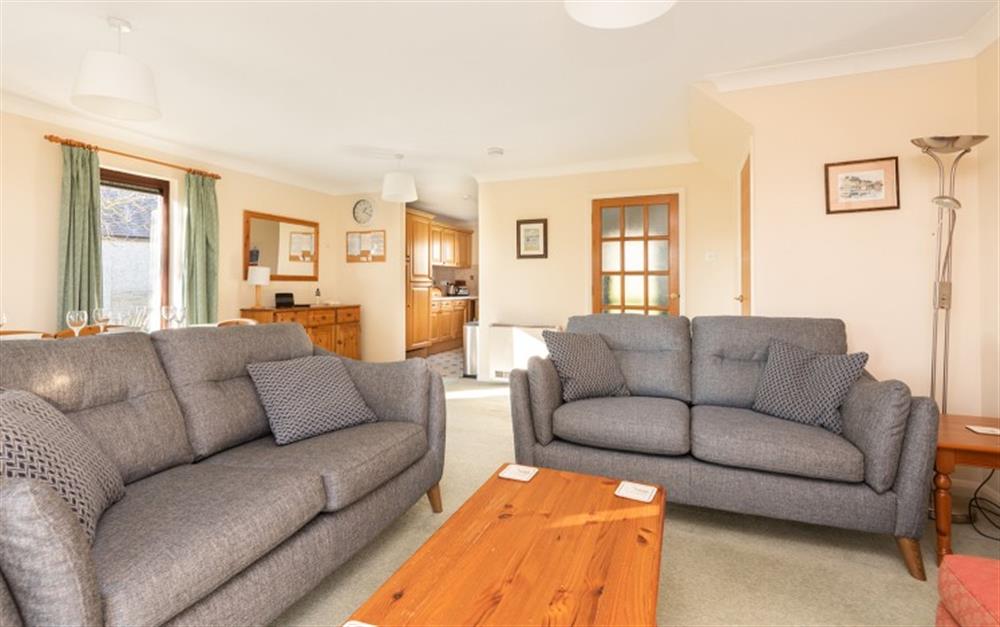 The comfortable lounge with a view of the kitchen in the background. at 67 Lower Maen Cottage in Maenporth