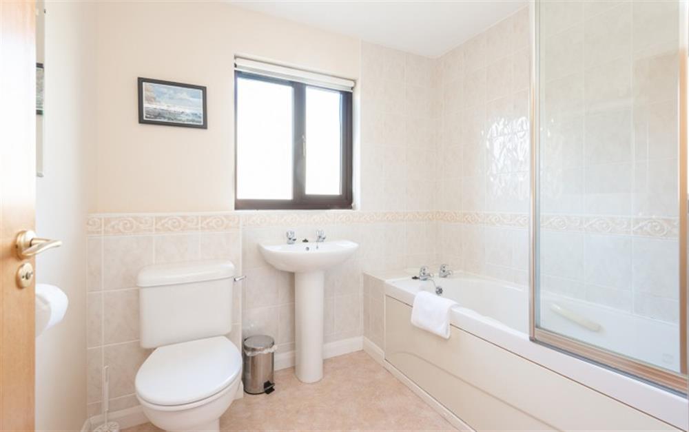 The family bathroom has the benefit of a shower over the bath. at 67 Lower Maen Cottage in Maenporth
