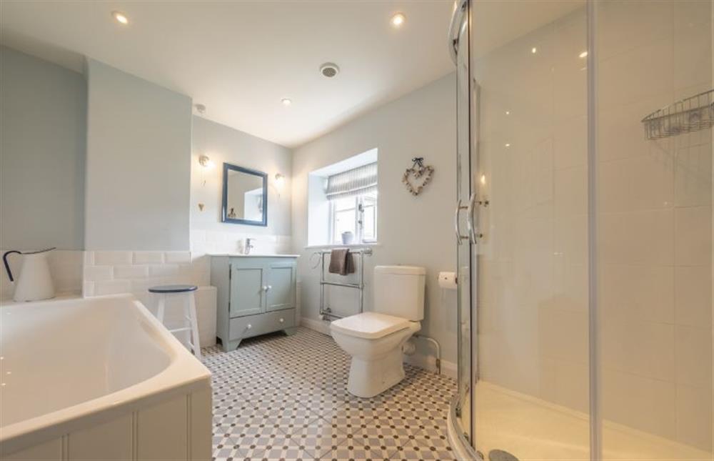 Bathroom with bath, separate shower, wash basin, WC and heated towel rail at 7 Albert Street, Holt