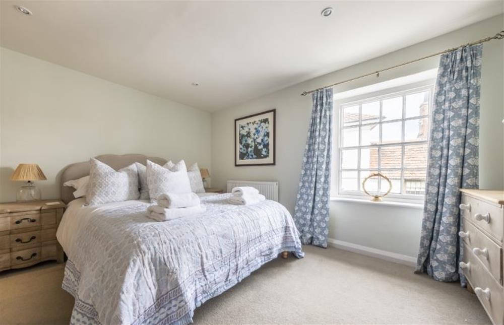 Bedroom with king-size bed at 7 Albert Street, Holt