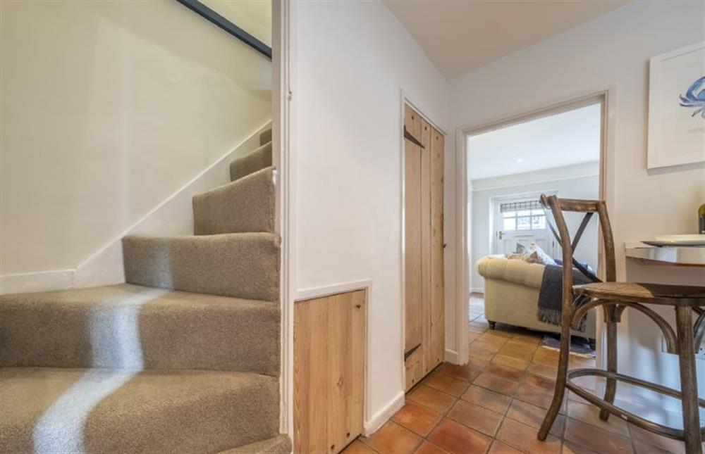 From the kitchen, a steep, Norfolk-winder staircase leads to the first floor at 7 Albert Street, Holt