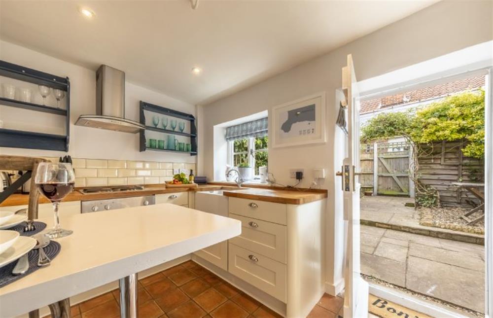 Kitchen/ diner with the door to the fully enclosed garden at 7 Albert Street, Holt