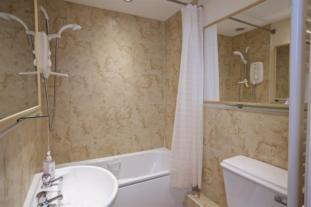 Family bathroom with bath and overhead shower at 7 Charles Street in , Dartmouth