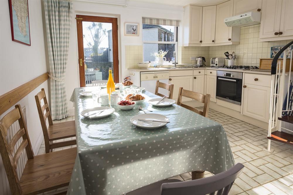 Kitchen leads to a terrace overlooking the harbour at 7 Island Quay in , Salcombe